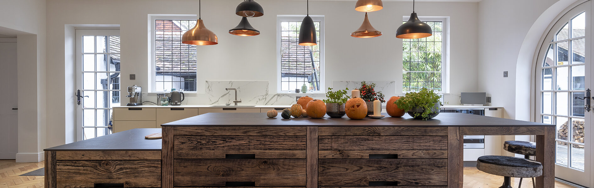 timber foot bench with electrical outlets with pumpkins