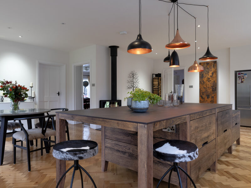 Large kitchen design with herringbone flooring and kitchen islands
