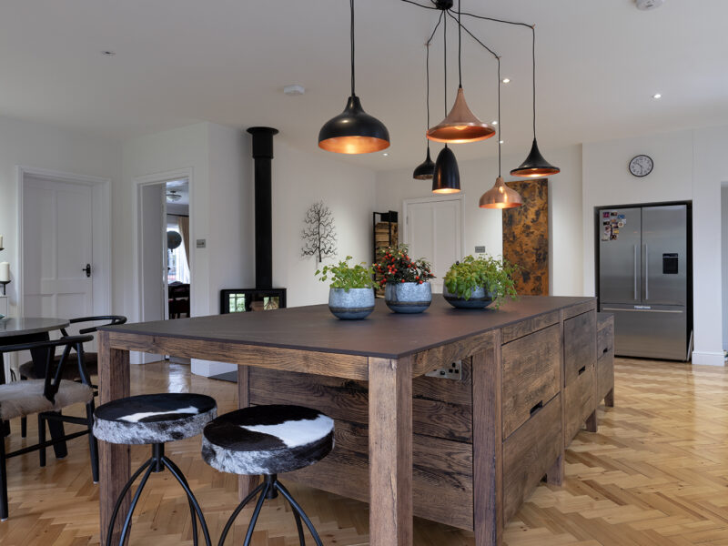Large kitchen design with herringbone flooring and kitchen islands