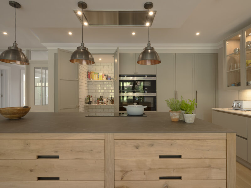 floor to ceiling cabinets with timber island and hidden pantry