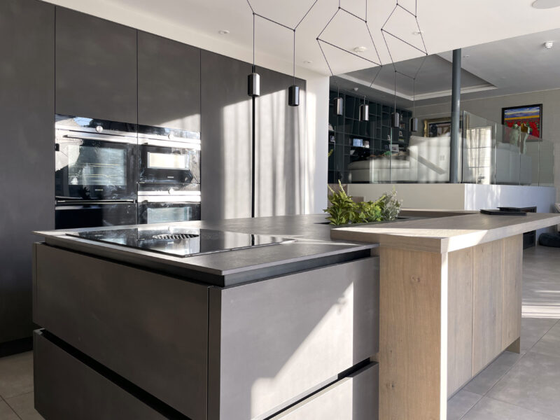 Lodge Close kitchen project - contemporary kitchen with a central island and a cabinet