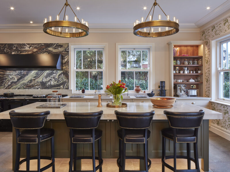 seating arrangement with chairs on side of the table in a kitchen